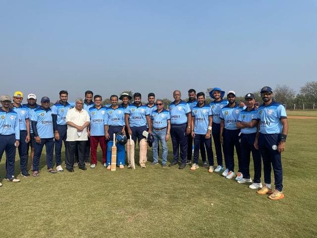 A team in sky-blue kit standing in a line on a ground
