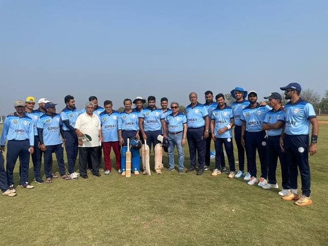 A team in light-blue kit lined up on a ground