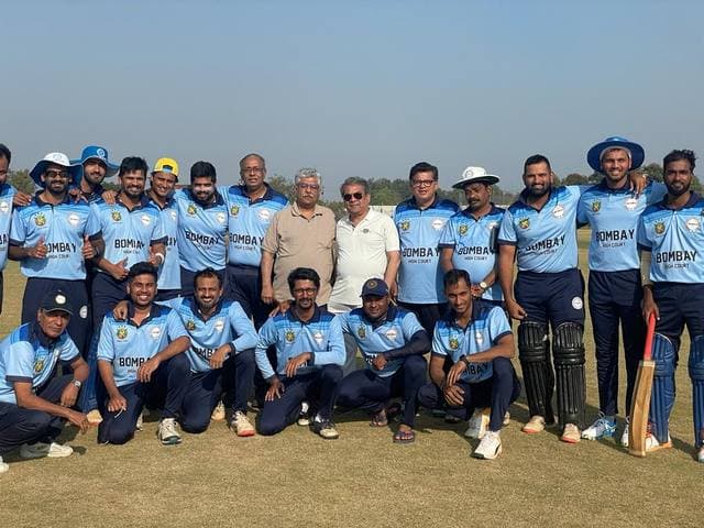 A crowded team photograph in light-blue kit